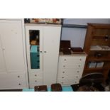 A modern two door wardrobe fitted three drawers to