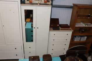 A modern two door wardrobe fitted three drawers to