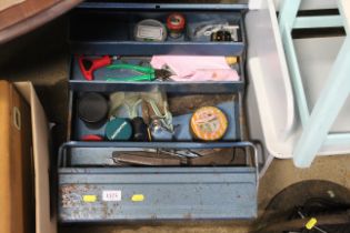 A metal cantilever tool box and contents of variou