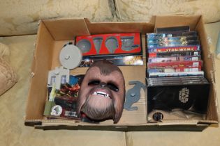 A box containing various Star Wars ephemera, DVDs