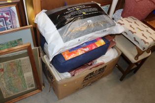 A box of various curtains and bedding