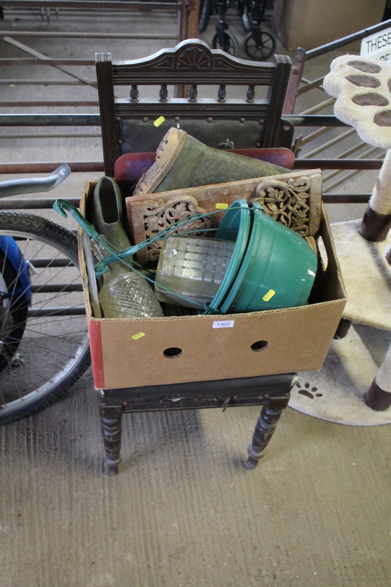 A wooden dining room chair and a box of sundries t
