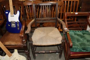 A Suffolk ball back elbow chair