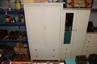 A modern two door wardrobe fitted two drawers