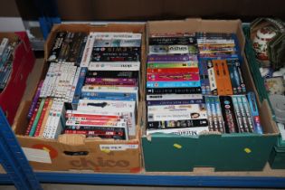 Two boxes containing various DVDs
