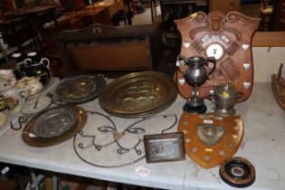 A collection of trophy cups and shields; plaques;