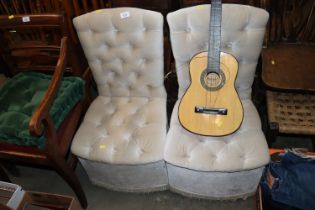 A pair of button down upholstered bedroom chairs