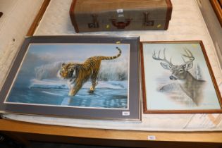 A framed and glazed print of a tiger, together wit