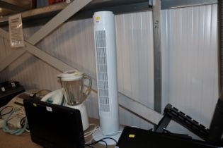 An oscillating tower fan