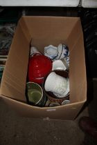 A box containing various plant pots, cooking pot e