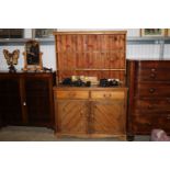 A pine dresser fitted two drawers on cupboard base