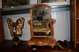 A pine swing framed toilet mirror