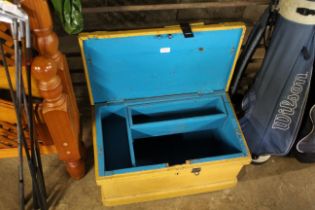 A painted wooden tool chest with hinged lid and in