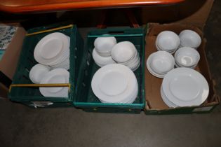 Three boxes of white glazed dinnerware