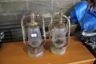 Two vintage storm lanterns