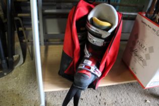 A pair of Solomon ski boots, size 27 in carry bag