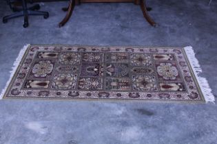 An approx. 5'10" x 3' patterned rug