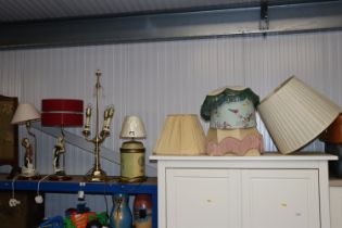 Two figural table lamps, a brass table and another