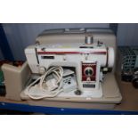 A New Home sewing machine in fitted case