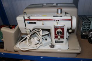 A New Home sewing machine in fitted case