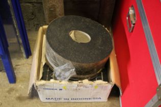 A quantity of wall tiles and a roll of roofing fel