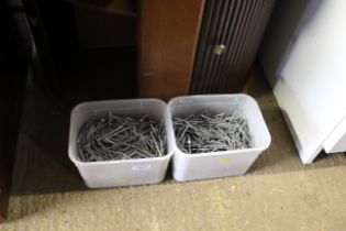 Two plastic tubs of various galvanized nails