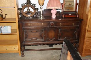 An oak sideboard fitted two drawers