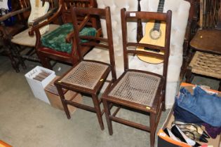 A pair of plain seated bedroom chairs