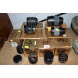 A quantity of Nikon camera lenses