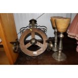 A wrought iron and wooden four branch candelabra t