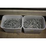 Two plastic tubs of various galvanized nails