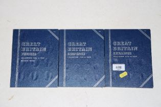 A book of 'Great Britain Shillings', another of 'Great Britain Sixpences' and another of 'Great