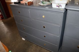 A grey painted pine chest fitted two short over th