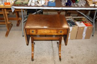 A 19th Century drop leaf table raised on stretcher