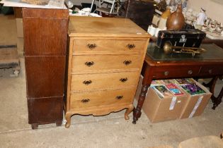 An oak chest fitted four long drawers, raised on s