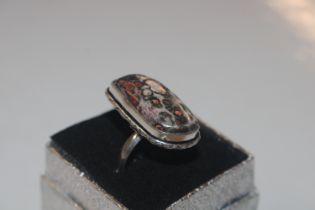 A 925 silver and pudding stone set ring