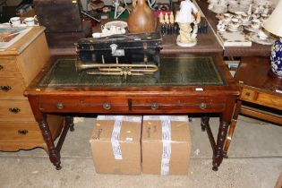 A mahogany writing table fitted two drawers with g