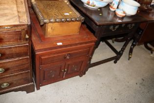 An Oriental hardwood side cupboard fitted with a single drawer