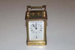 A brass cased carriage clock AF