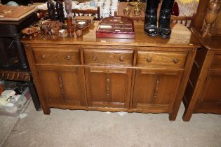 An Ercol sideboard fitted three drawers