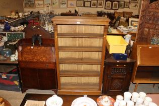 An oak open fronted bookcase