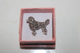 A vintage silver and marcasite brooch in the form