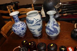 A dragon decorated crackle glazed vase on stand to