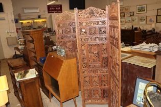 A carved four fold screen