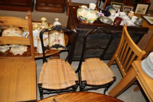 A pair of cane seated chairs