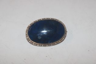 An antique white metal and blue jasper stone brooc