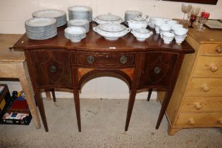 A regency style sideboard fitted single central drawer flanked left and right by cupboards