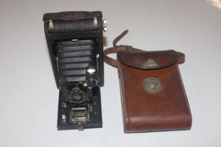 A Kodak folding camera in leather case