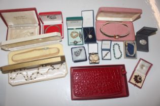 A box containing various costume jewellery includi