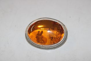 A Sterling silver and amber brooch